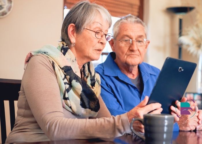 Healthcare professional providing guidance to family about senior care