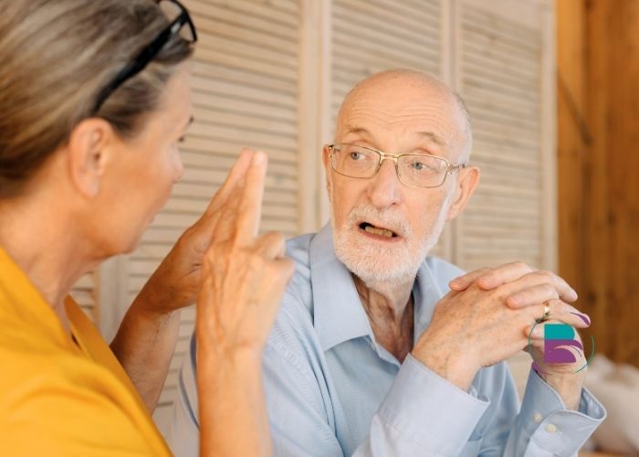 Family discussing care needs with healthcare professional